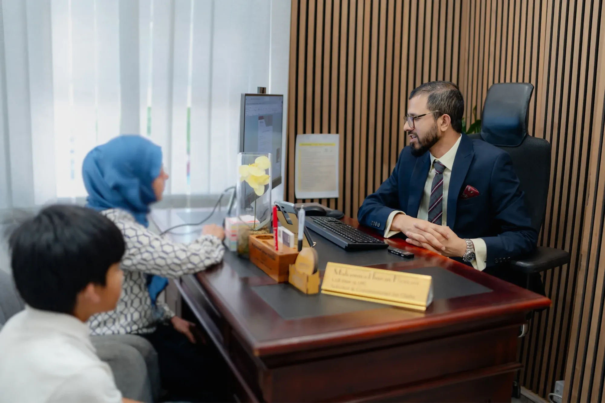 A solicitor working at the front desk